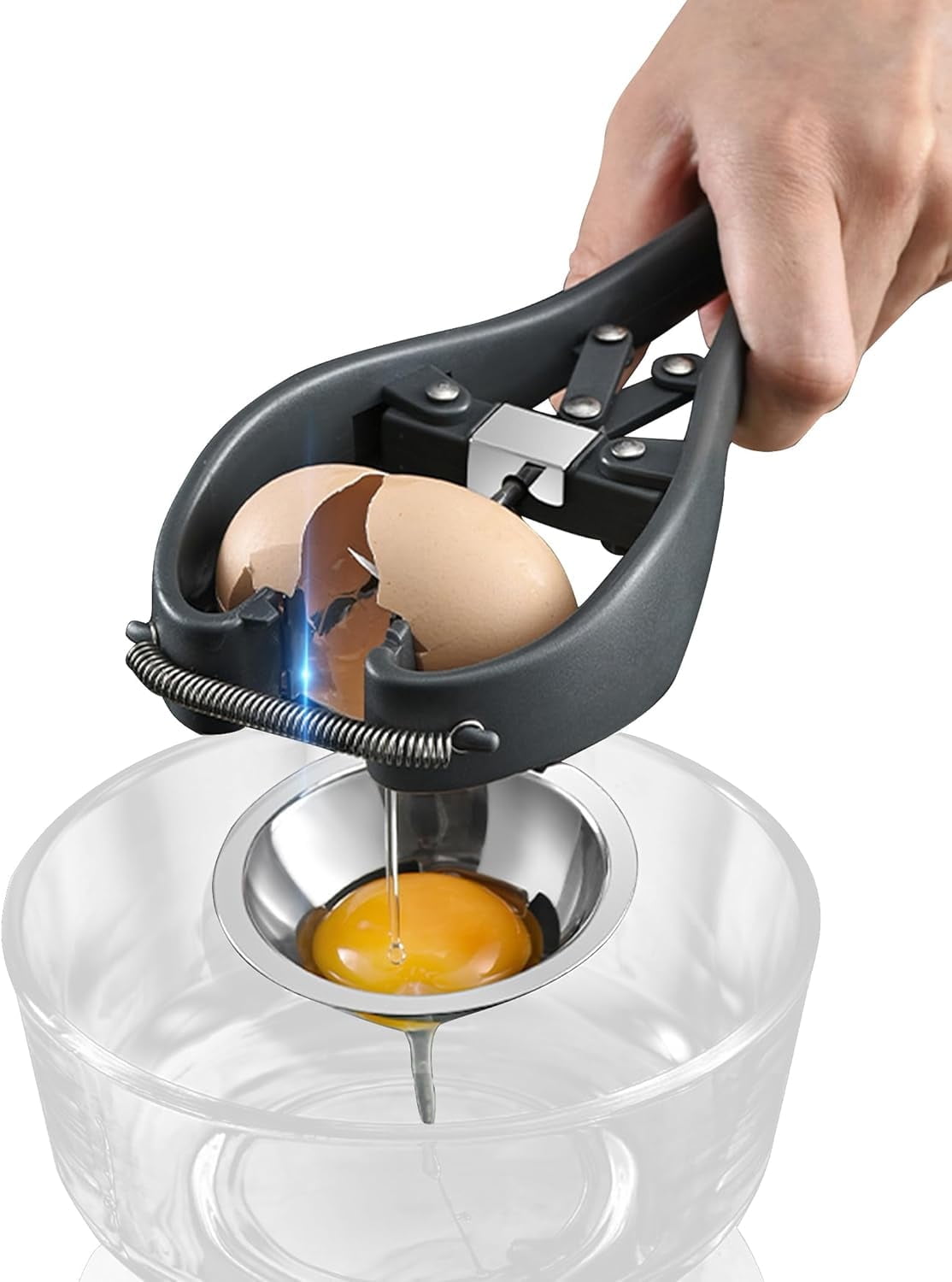 Hand using black egg cracker separator over bowl