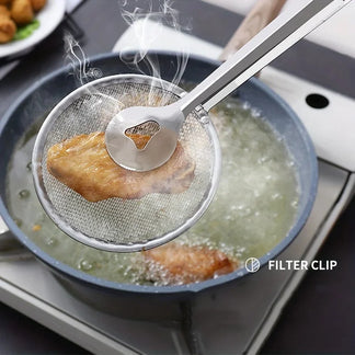 Strainer tongs frying chicken in pan