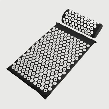 Acupressure mat and pillow, angled view on white